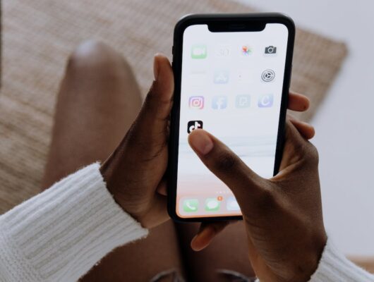 clicking the TikTok app on an iPhone