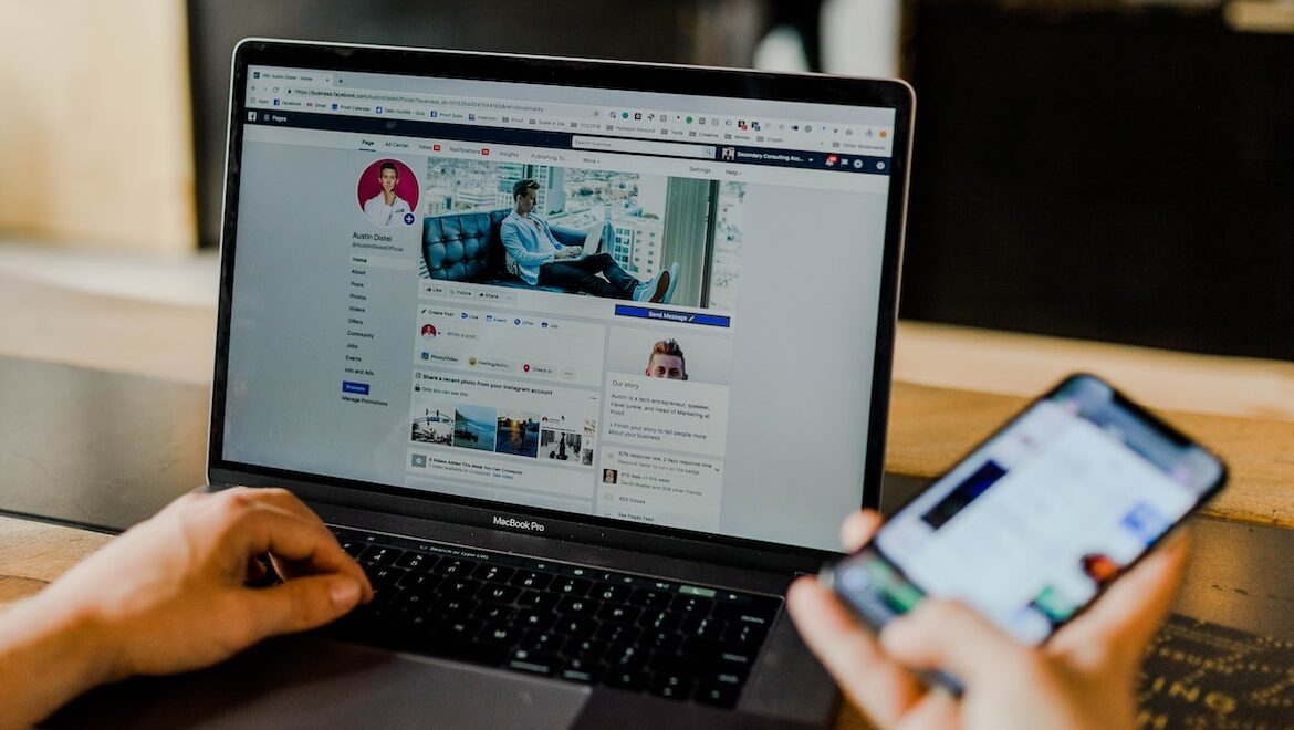 facebook page displayed on the laptop