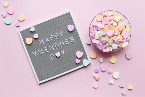 Heart shape candy and Valentine’s Day sign