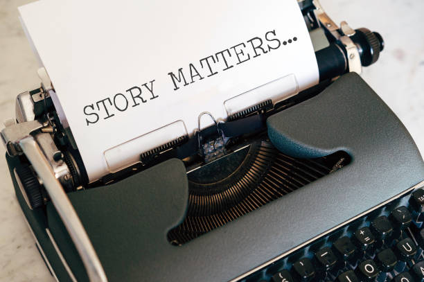 close up image of a vintage typewriter with paper sheet and the words story matters