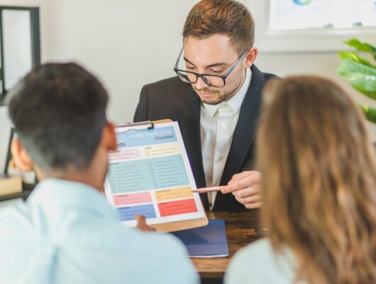 executive talking to clients